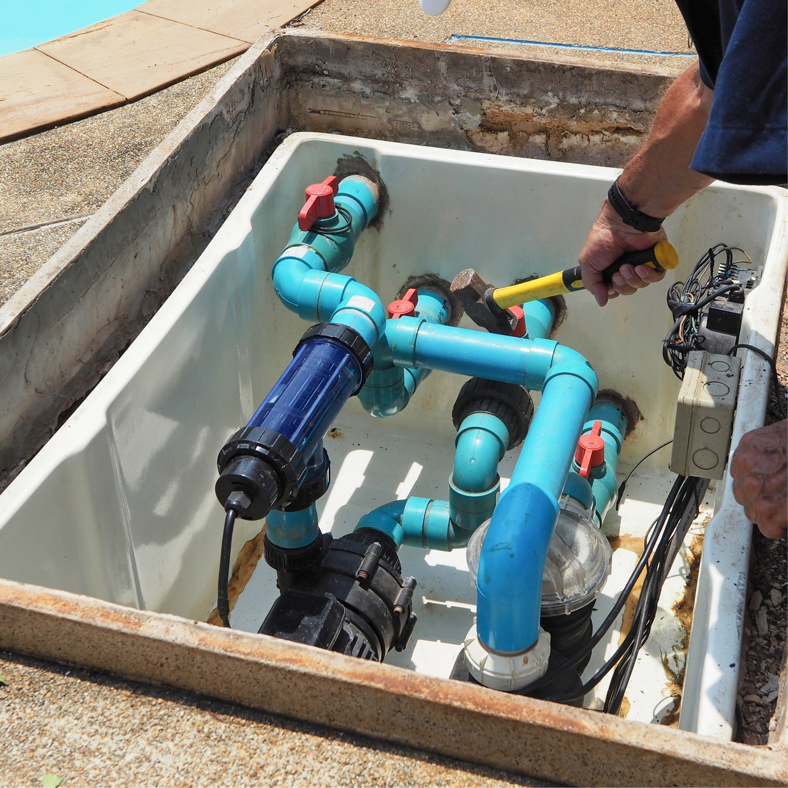 pool repair technician diagnosing equipment during repair pool service in El Cajon