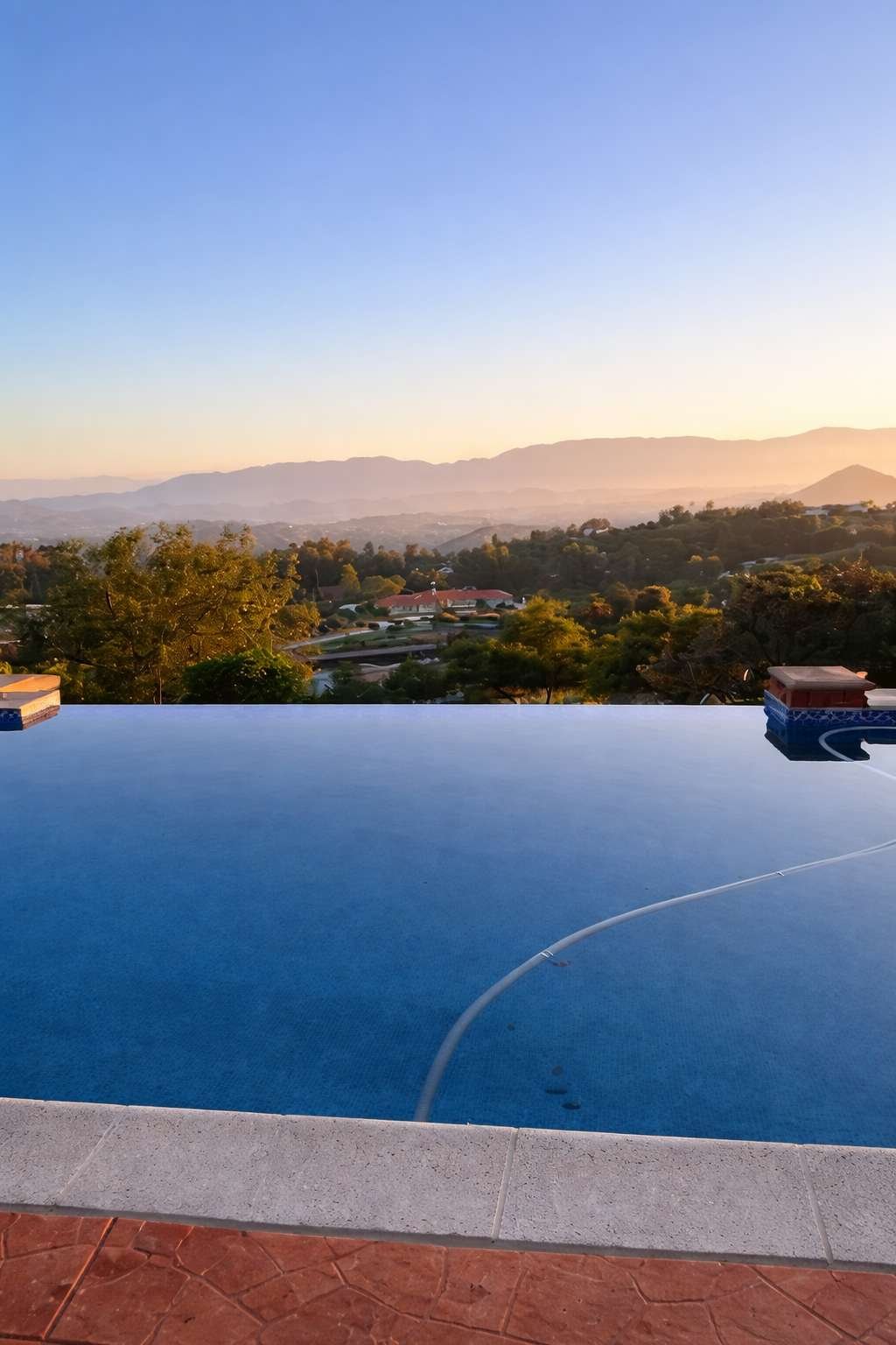 Home Serene sunset by the infinity pool